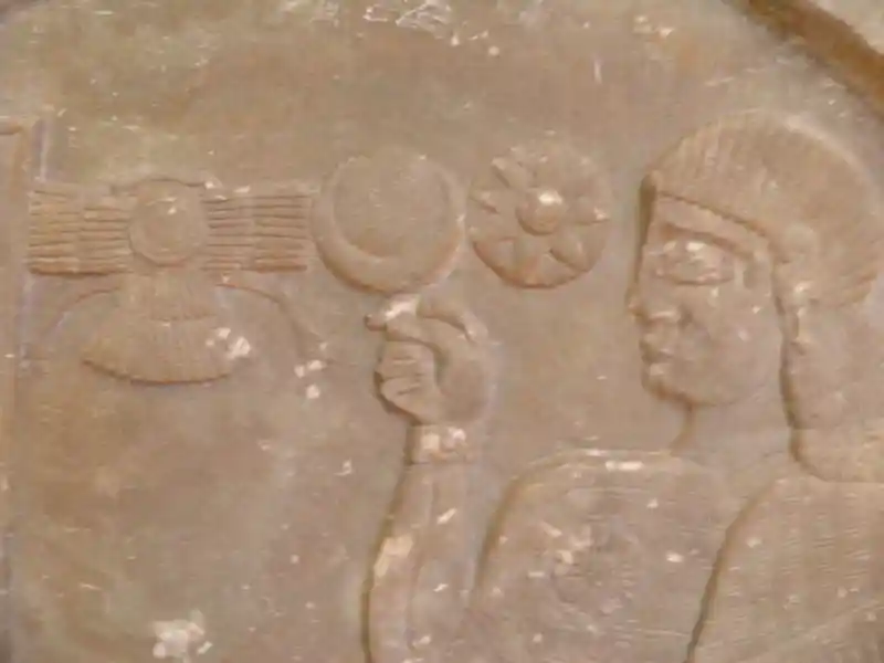 Stele with inscription and relief, winged disc, solar disc